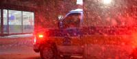 ambulance driving in the snow at night
